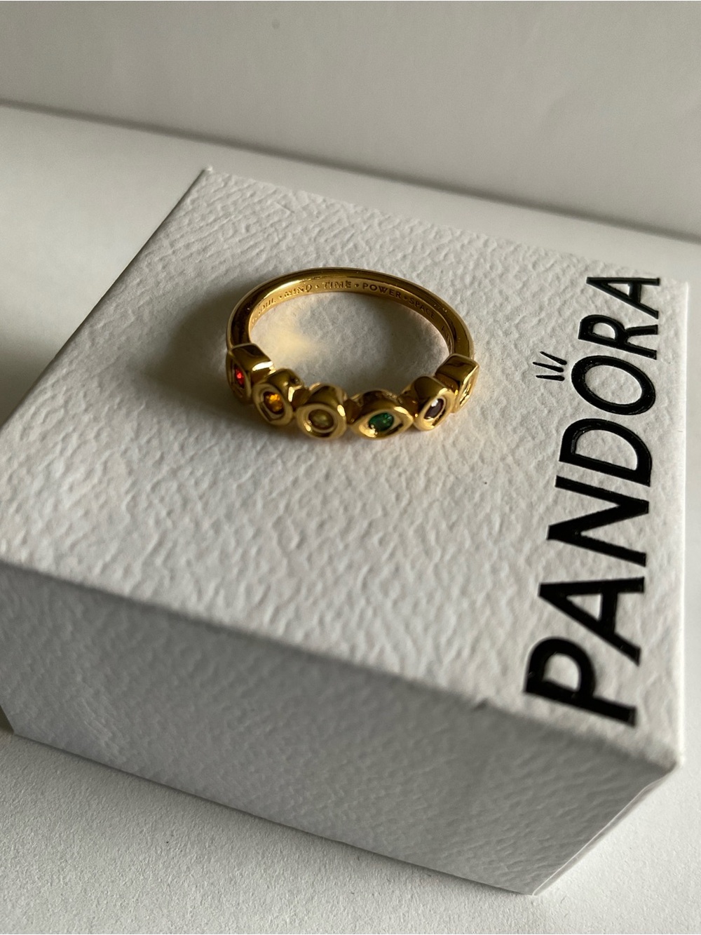 Pandora Gold Tone Ring with Red and Green Gem Accents